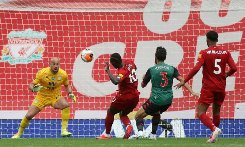 Senegalese Sadio Mane (C) scores the opening goal for Liverpool in a 2-0 win over Aston Villa at Anfield