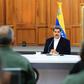 President Nicolas Maduro, shown in a handout picture released by the Venezuelan Presidency speaking to members of the Bolivarian National Armed Forces (FANB), announced that two Americans were arrested for taking part in the failed "invasion"