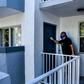 Mario Amate, who used to work as an Uber driver and recently found himself unemployed, knocks on a door to deliver homemeade tequenos, a popular Venezuelan snack, to a customer