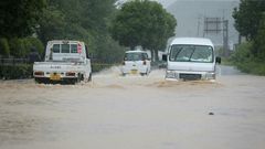 Reports said 75,000 residents were ordered to evacuate their homes, with nearly 100 people stranded