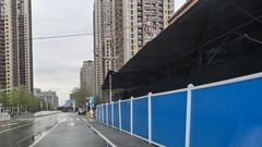 The market in Wuhan, China, where the new coronavirus was first detected has been sealed behind a tidy partition