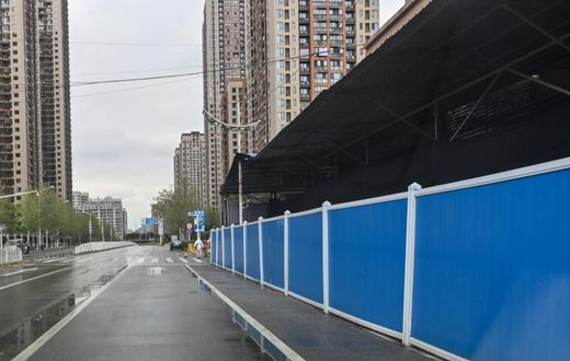 The market in Wuhan, China, where the new coronavirus was first detected has been sealed behind a tidy partition