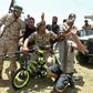 Fighters loyal to Libya's UN-recognised Government of National Accord pose for a picture with a children's bicycle  as they celebrate the capture of the town of Tarhuna, about 65 kilometres southeast of the capital Tripoli