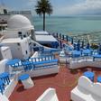 A cafe stands empty in the Tunisian village of Sidi Bou Said, where streets are usually filled with tourists at this time of year