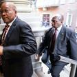 Former South African President Jacob Zuma (C) is alleged to have taken bribes tied to a $3.4 billion arms deal