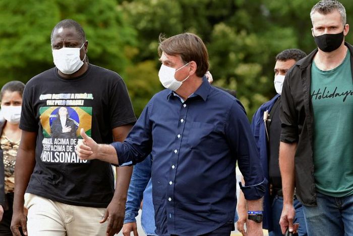 Brazilian President Jair Bolsonaro (pictured May 24, 2020), who regularly rails against the mainstream media, occasionally stops outside the Alvorada Palace in Brasilia to speak to the press, but the informal event has turned tense at times