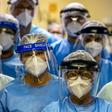 A group of doctors working with patients infected with the novel coronavirus COVID-19 wear face shields at the Intensive Care Unit of the Hospital de Clinicas in Porto Alegre, Brazil