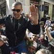Algerian protesters carry journalist Khaled Drareni, who was arrested while covering an anti-government protest and was accused of "inciting an unarmed gathering and damaging national integrity," on their shoulders on March 6, 2020 in Algiers