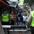 Alongside police and troops overseeing enforcement measures, provincial leaders are running their own zealous campaigns to fight the virus in Indonesia