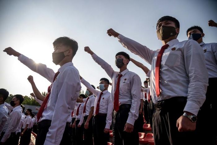 Students and youths attend a mass gathering denouncing 'defectors from the north', at the Pyongyang Youth Park Open-Air Theatre, in Pyongyang, on June 6, 2020