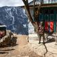 Security personnel stand guard during a nationwide lockdown in Namche Bazar in the Everest region. Thousands of tourists and trekkers are stranded in far-flung areas of Nepal