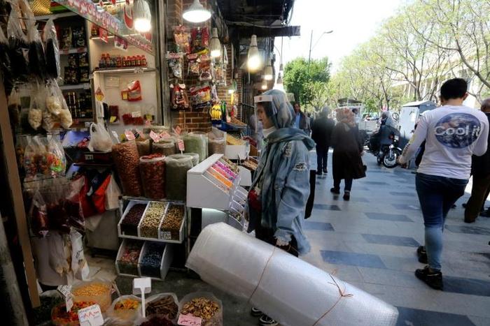 With an economy battered by US sanctions, many Iranians are reopening businesses despite the risks posed by the novel coronavirus