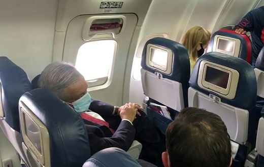 Mexican President Andres Manuel Lopez Obrador wore a face mask on the plane as he traveled to Washington to meet US President Donald Trump