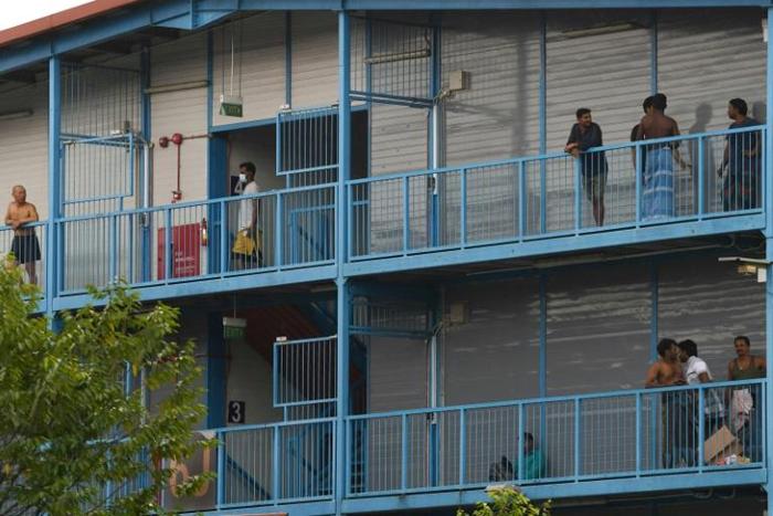 Singapore has quarantined four large dormitory complexes housing tens of thousands of mostly South Asian workers, where more than 200 coronavirus cases have been detected