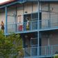 Singapore has quarantined four large dormitory complexes housing tens of thousands of mostly South Asian workers, where more than 200 coronavirus cases have been detected