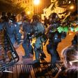 Police charge a barricade in the street during a demonstration against the death of George Floyd near the White House