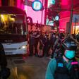 Police detain people on a bus after they clear protesters taking part in a rally against a new national security law in Hong Kong on July 1, 2020