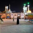 A cleric prays outside the Fatima Masumeh shrine in Iran's holy city of Qom on March 16, 2020, the day it was closed due to the coronavirus