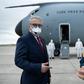 Turkey's ambassador to the United States, Serdar Kilic, waits as a Turkish cargo plane carrying COVID-19 relief supplies is unloaded at Andrews Air Force Base near Washington in April 2020