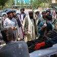 A  man injured in an explosion at a cattle market is brought to in Lashkar Gah, Helmand province