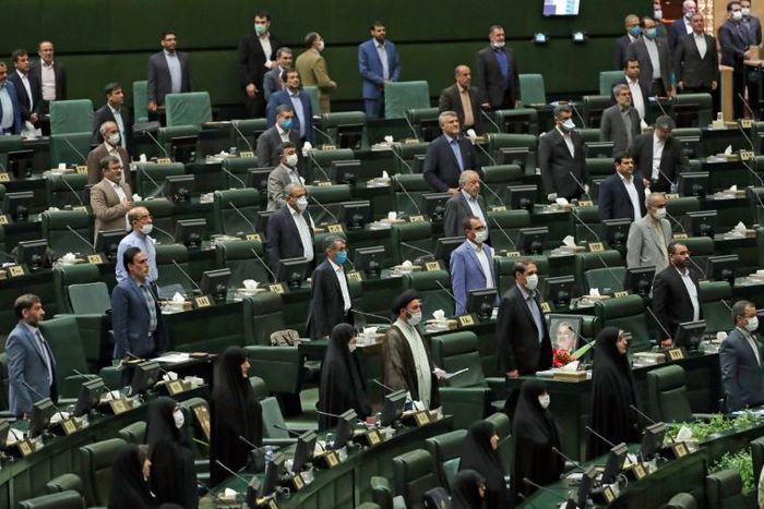 For the opening session of Iran's new parliament, a seat was left vacant between each lawmaker in accordance with social distancing guidelines although few wore masks against the coronavirus