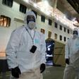 Police officers in protective gear prepare to board the coronavirus-stricken Ruby Princess cruise ship and seize its black box at Port Kembla, Australia