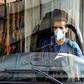 A Tehran bus driver wearing a protective mask as a precaution against coronavirus