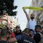 Lebanese army troops form a human chain to separate supporters of Hezbollah from other demonstrators after they clashed during a protest in central Beirut