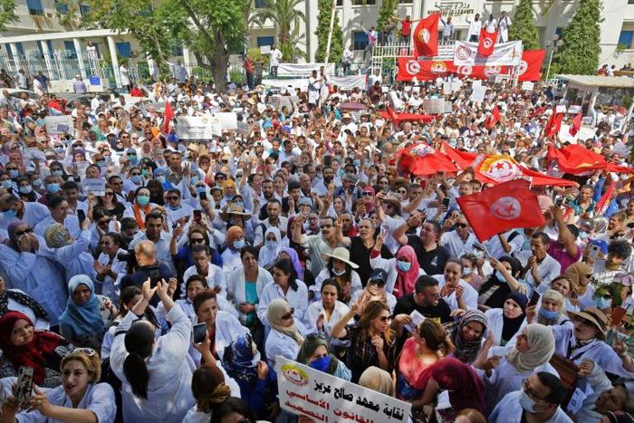 Thousands of Tunisian public health workers protested in front of the health ministry in the capital Tunis