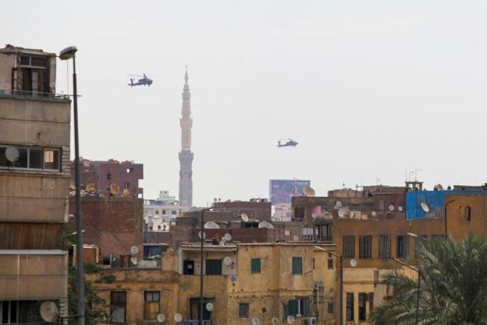 Egyptian air force Apache attack helicopters fly over Cairo on June 2, 2018, as Egyptian President Abdel-Fattah al-Sisi is sworn in for a second four-year term