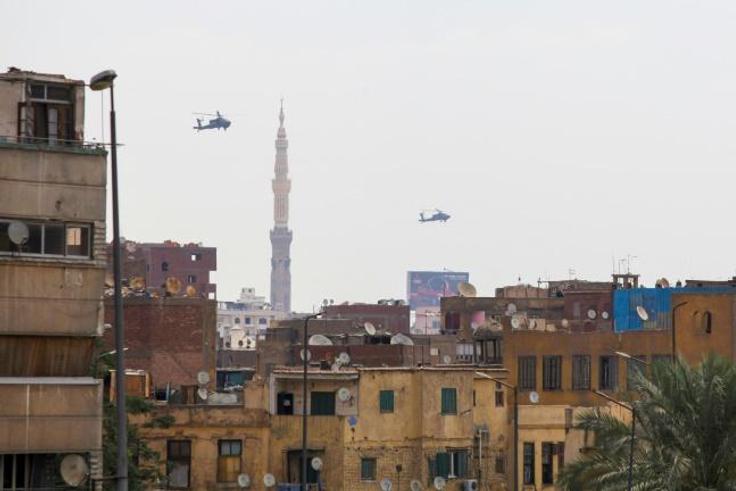Egyptian air force Apache attack helicopters fly over Cairo on June 2, 2018, as Egyptian President Abdel-Fattah al-Sisi is sworn in for a second four-year term