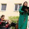 Monika Medek and the Camerata Carnuntum orchestra perform for guests during the 'window concert' at the Vienna hotel