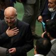 Iranian Mohammad-Bagher Ghalibaf (C) stands among members of parliament after being elected speaker
