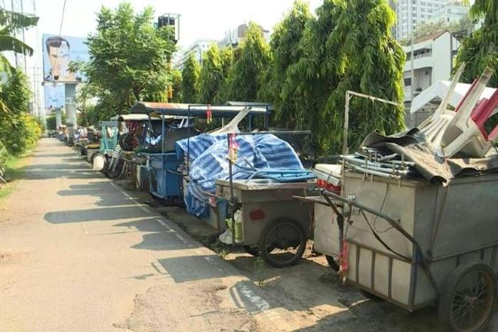 Empty food carts with chairs stacked on them sit in a lot next to a busy Bangkok highway -- the latest casualty of a deadly coronavirus which has stunted global travel and economies.