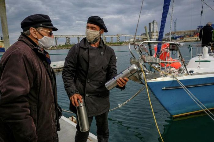 Juan Manuel Ballestero (R), with his father Carlos in Mar del Plata, Argentina, after sailing home from Portugal due to pandemic travel restrictions to see his parents