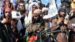 Afghan Taliban militants and villagers celebrating the deal with the US in March 2020