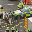 Police say one man is dead and six people were injured in a suspected stabbing attack in Glasgow