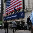 The New York Stock Exchange, the symbolic heart of Wall Street, reopened its floor after a two-month closure due to the coronavirus, with traders donning masks and separated by plexiglas