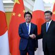 Japan's Prime Minister Shinzo Abe (left) shakes hand with China's President Xi Jinping at the Great Hall of the People in Beijing in December 2019