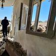 A man walks through the rubble of a building that was damaged when strongman Khalifa Haftar's forces shelled the neighborhood in the Libyan capital Tripoli on May 1, 2020 -- Hafter has been receiving help from Russian mercenaries, a UN report says