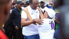 First Lady Margaret Kenyatta receives President Uhuru Kenyatta after competing in the Beyond Zero Half Marathon