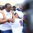 First Lady Margaret Kenyatta receives President Uhuru Kenyatta after competing in the Beyond Zero Half Marathon