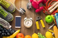 High Angle View Of Various Fruits With Exercise Equipment On Table