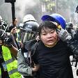 Protesters are detained by police near the Hong Kong Polytechnic University in November 2019