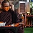Thai monks are weaving recycled synthetic fibres with cotton into piles of saffron-coloured masks