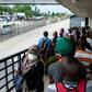 People walk on a pedestrian bridge without adhering to social distancing in Dar es Salaam, Tanzania, in April 2020