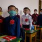 North Korean children wearing face masks against COVID-19 attend class on June 3, 2020 in Pyongyang, where Kim Jong-Un has praised the country's response to the virus