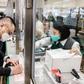 Hong Kongers like Adrian W. Chan (L) are now sending parcels of face masks and other supplies to friends and relatives abroad as the virus spreads