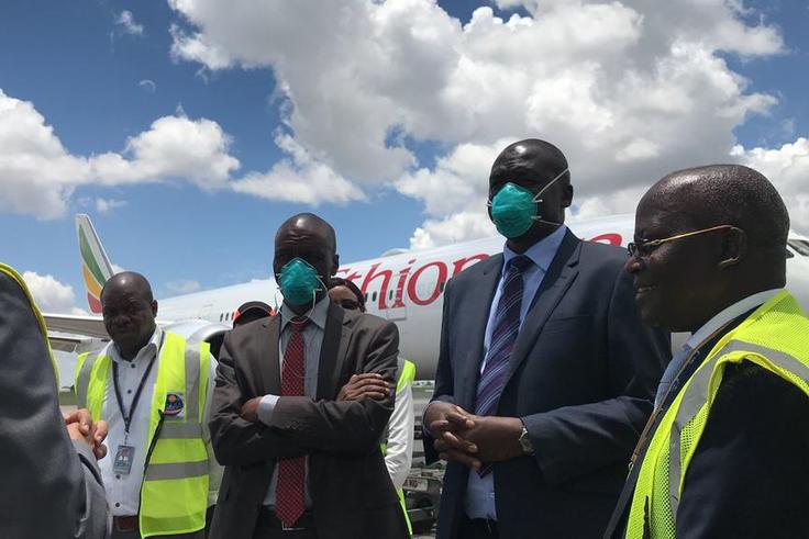 Kenya’s Ministry of Health officials receiving the country’s share of supplies at JKIA. (twitter)