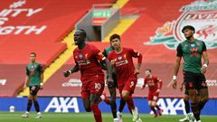 Sadio Mane (centre) celebrates his 20th goal of the season for Liverpool